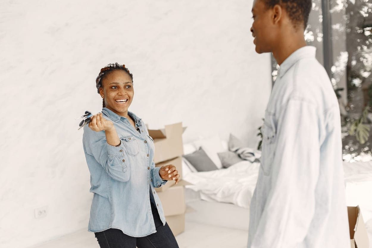 A couple with the keys to their new home (illustrative photograph)
