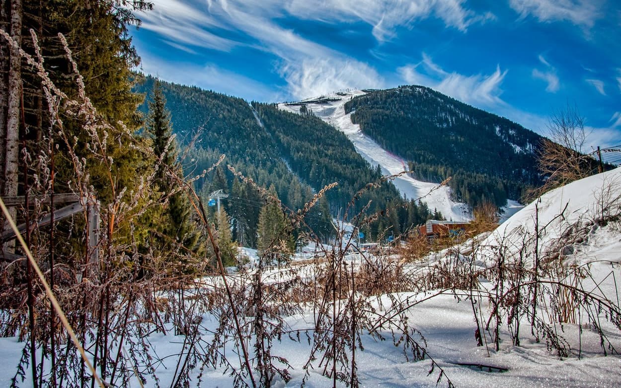 Skiers on the slopes at Bansko ski resort